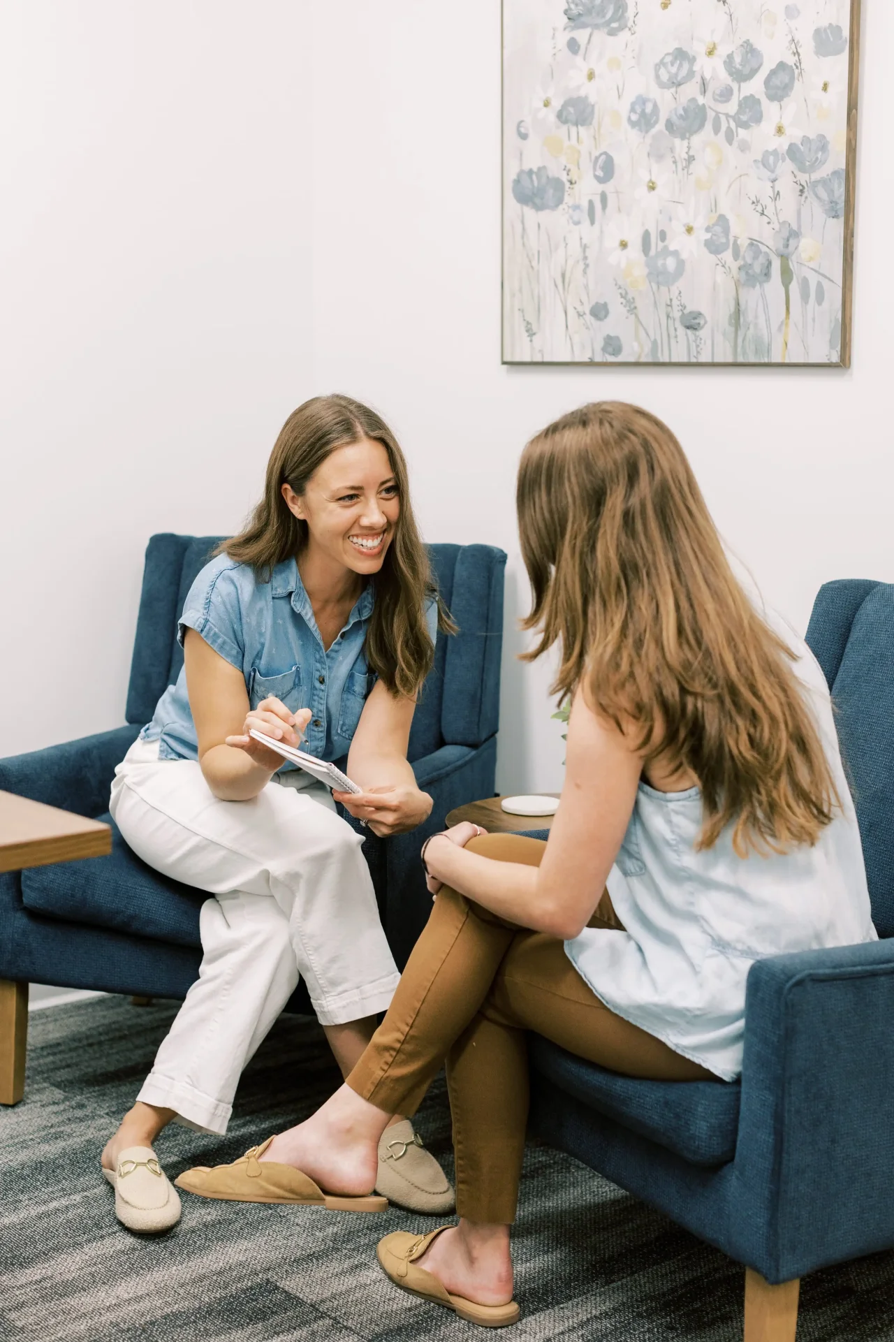 Physical therapist consultation with patient